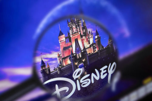 Disney castle logo under a magnifying glass.
