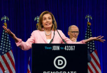 Catholic University SHOCKS—Invites Pelosi Despite BAN… Nancy Pelosi speaking at Democratic National Committee event.