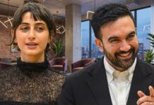 NYC’s Largest Community REVOLTS Against Mamdani… Two professionals engaged in conversation in a modern office setting