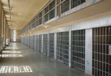 Sri Lanka Lockup Explodes — 25 Dead Empty prison cell block with barred doors and walkway.
