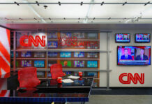 Media Bias Exposed? Tapper Faces Trump CNN World Headquarters studio with empty red chairs.