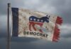 Democrats Panic: Maine Time Bomb Ticks A weathered flag featuring the Democratic Party symbol and the word 'DEMOCRAT'